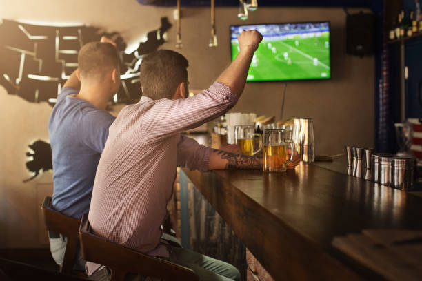 What are the must-visit bars in Dallas for football fans?